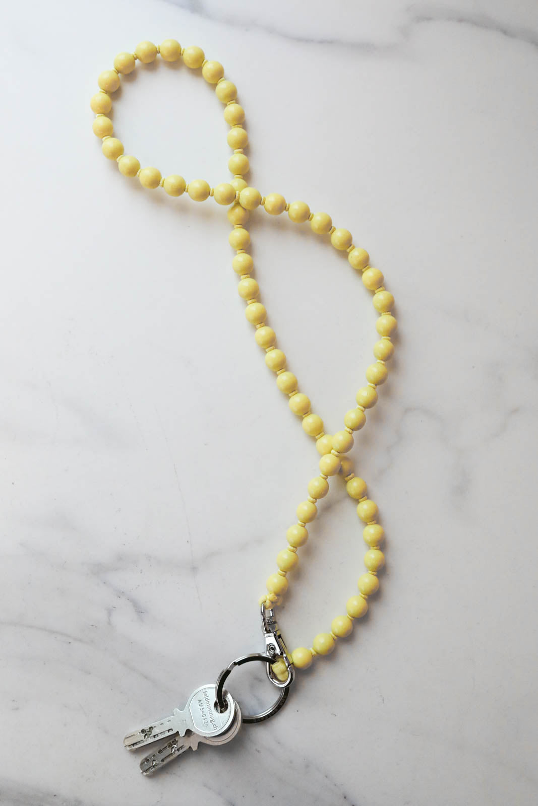 Ina Seifart, Schlüsselanhänger in Pastellgelb/Gelb