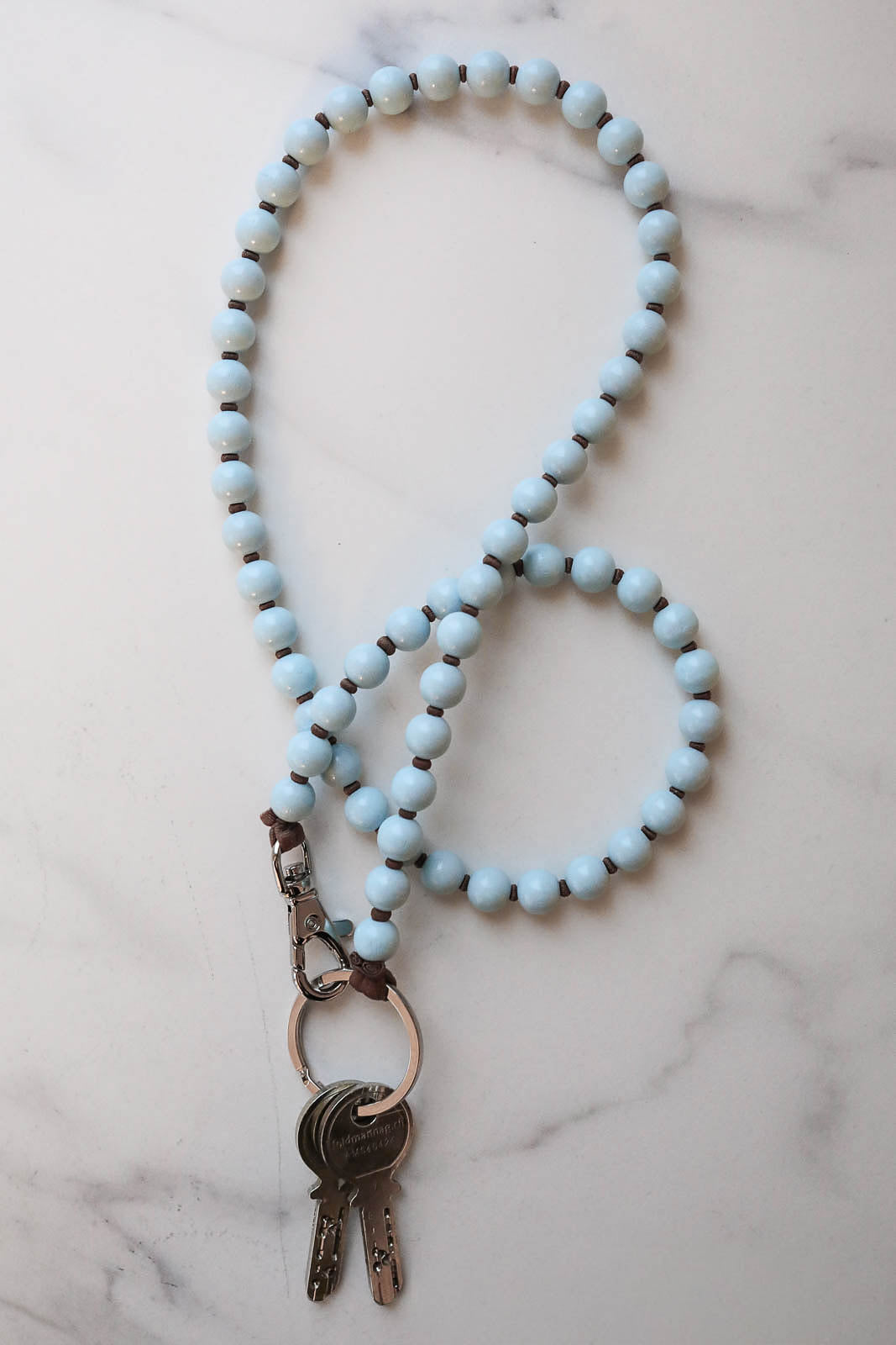Ina Seifart, Schlüsselanhänger in Pastellblau/Mocca