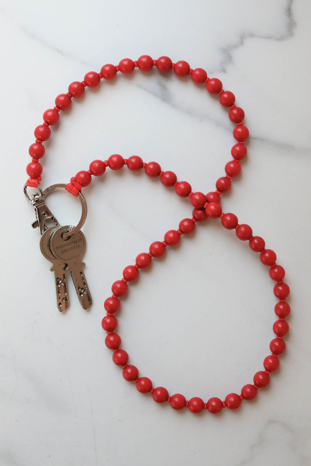 Ina Seifart, Schlüsselanhänger in Rot/Rot