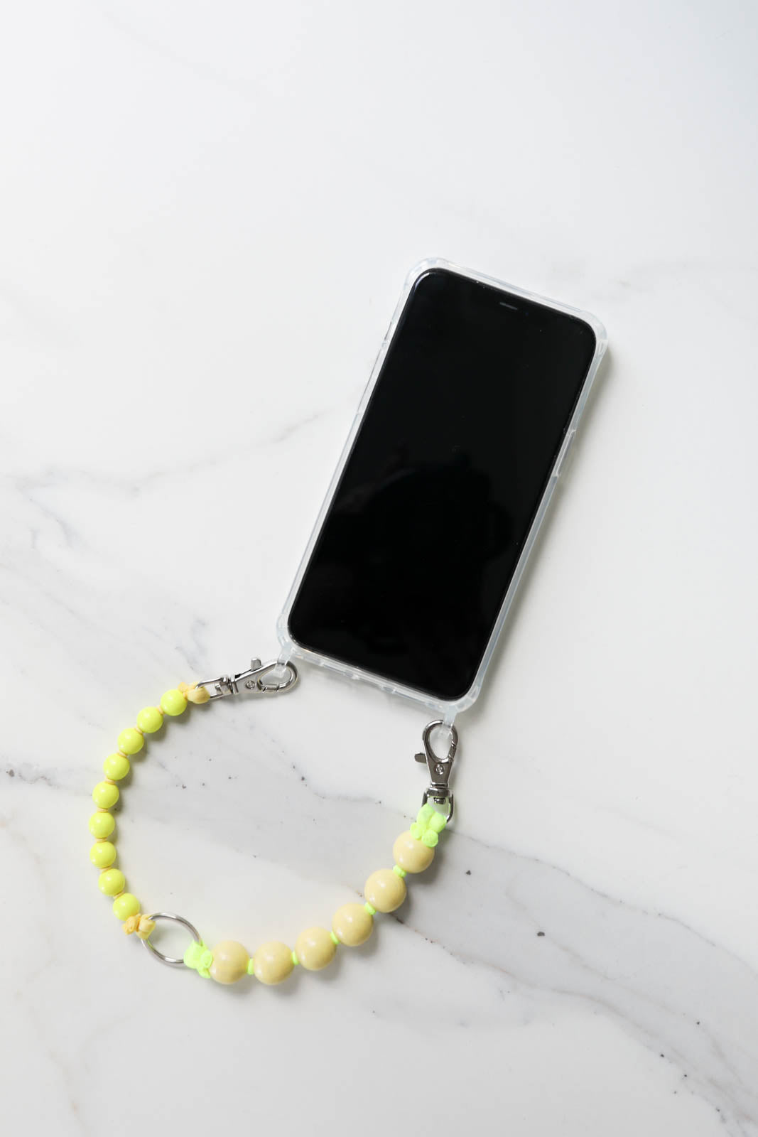 Short double cell phone chain in pastel yellow