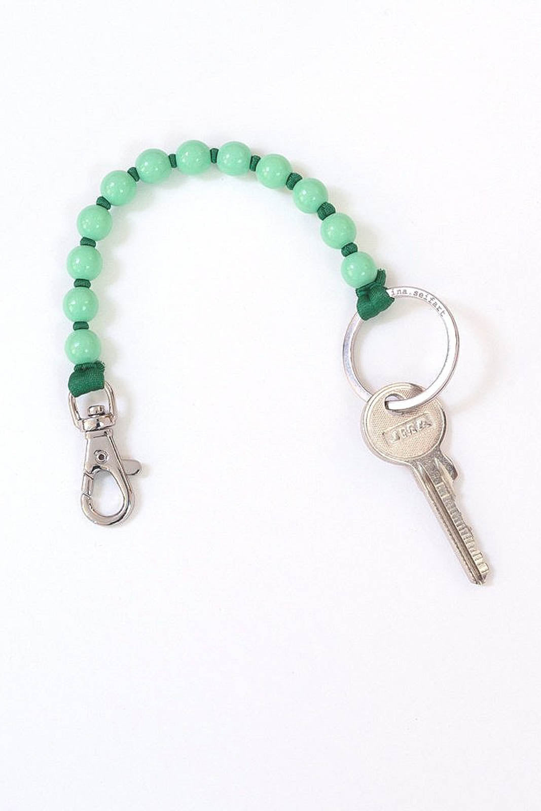 Key ring beads short in pastel green/green