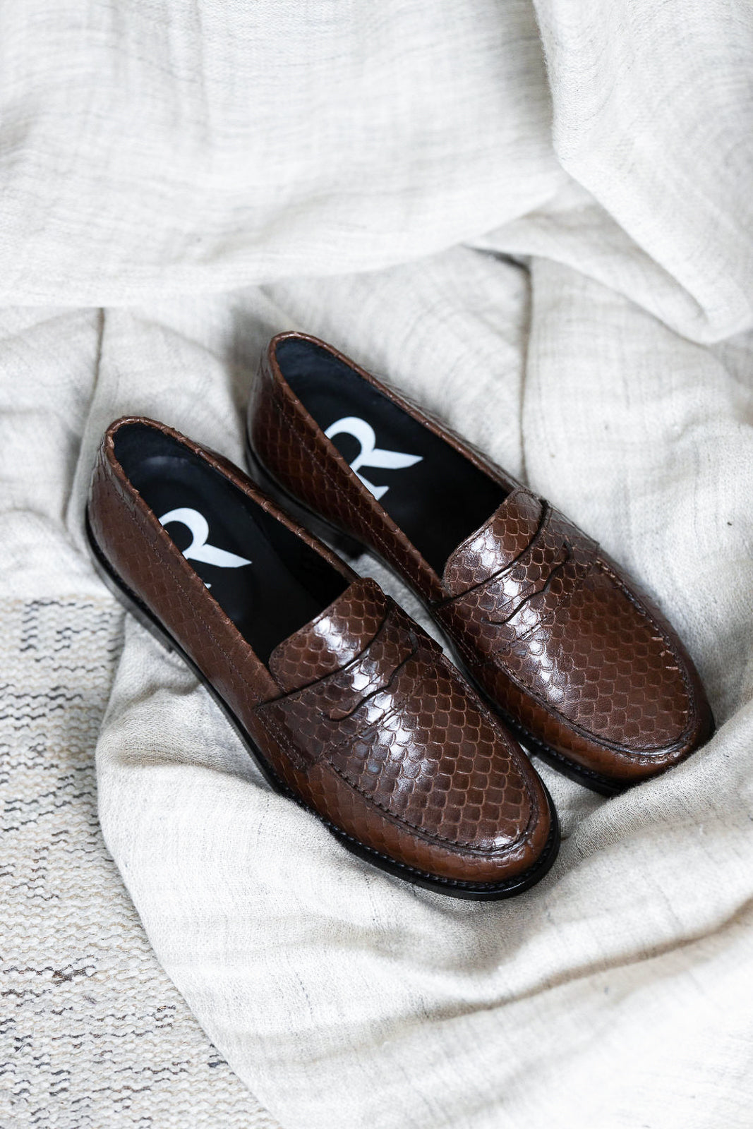 Embossed leather moccasins in Python Chocolat