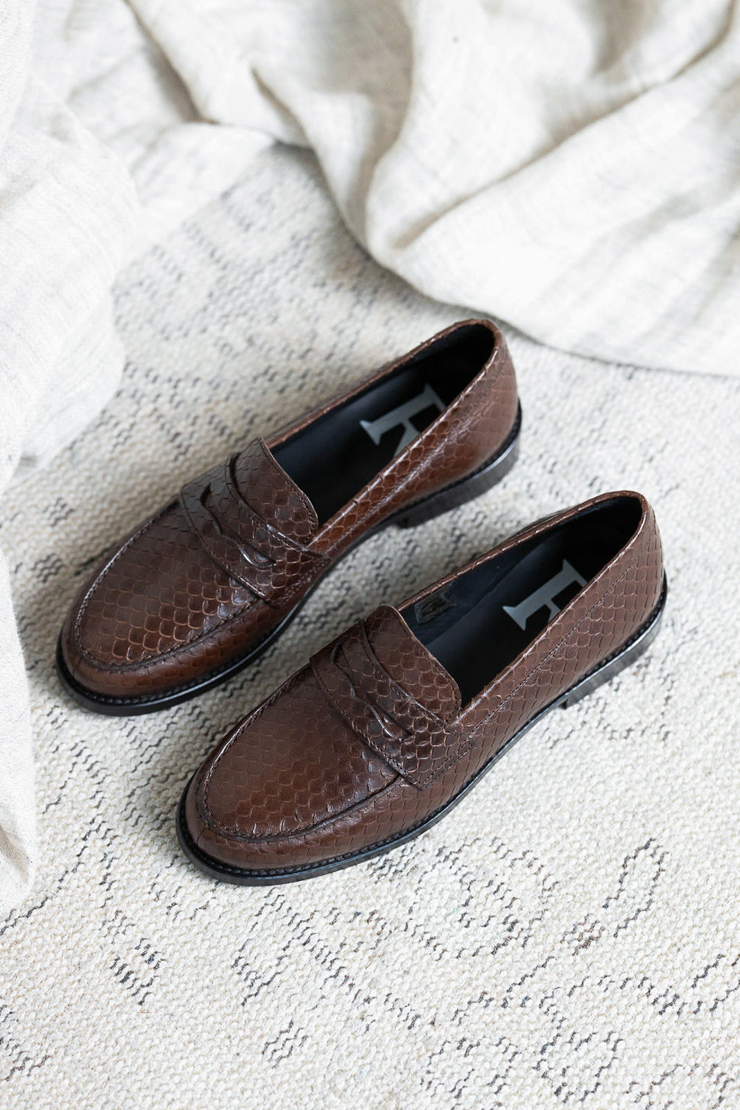 Embossed leather moccasins in Python Chocolat